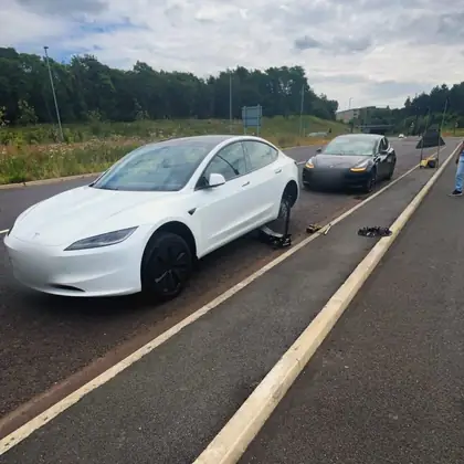 White car with its rear wheel off at the side of the road during a ResQ Tyres emergency call-out